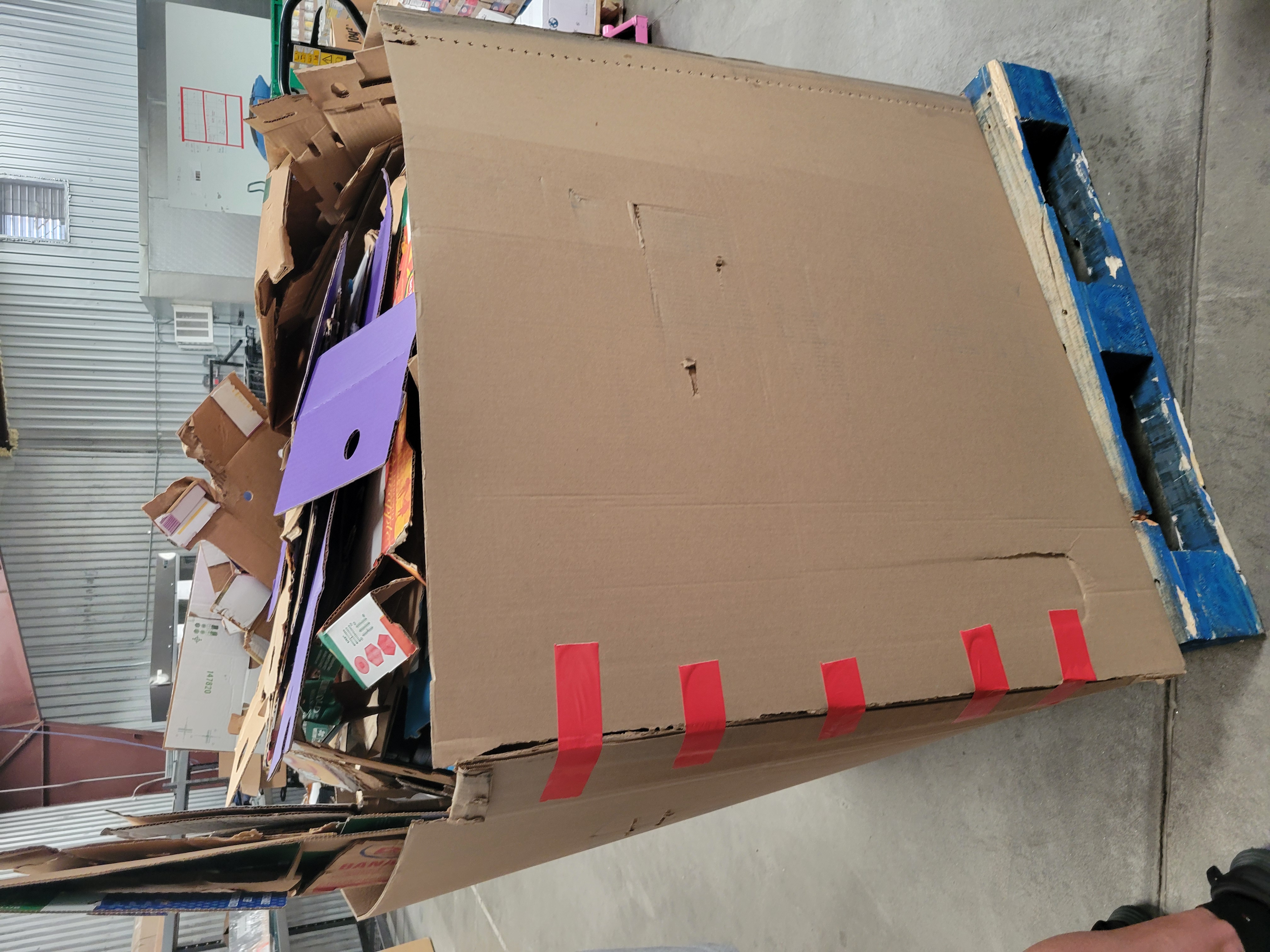 Cardboard container full of cardboard.